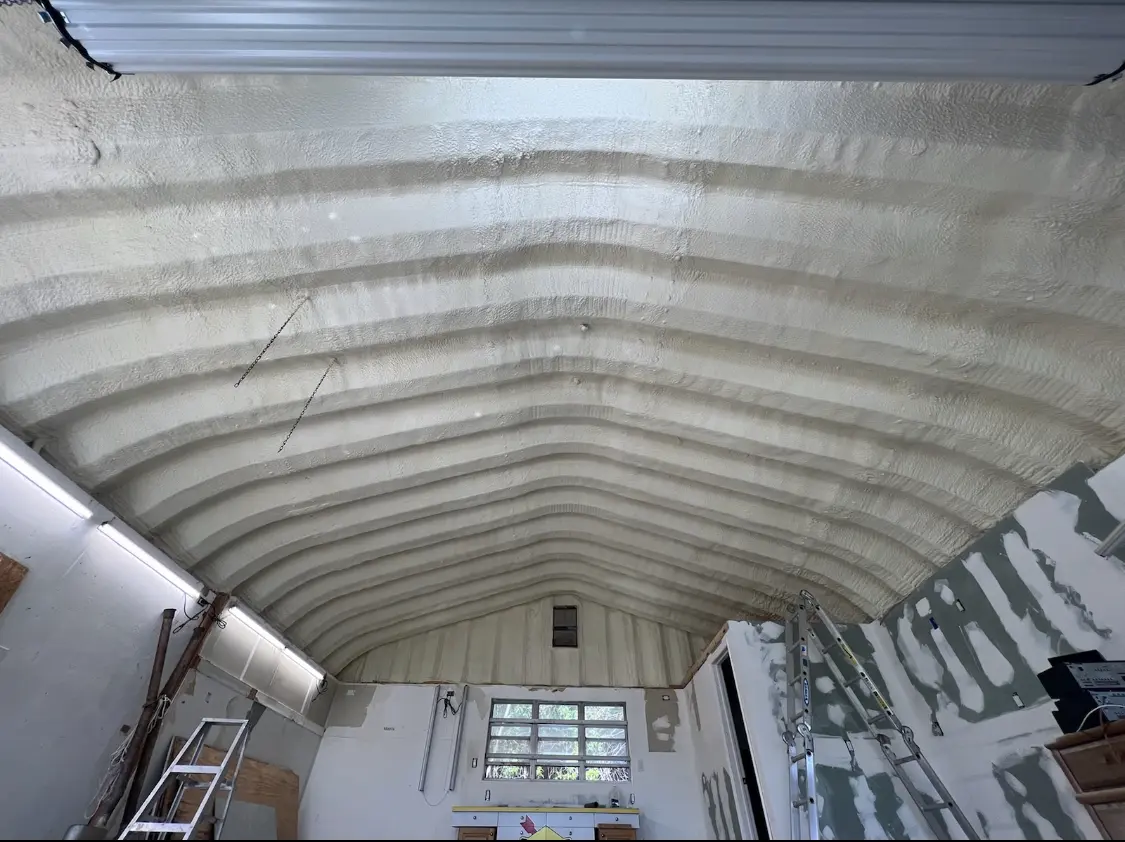 Spray polyurethane foam applied to the underside of a metal roof deck in Hillside